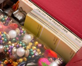 Detail of brightly colored objects packed closely together in a fuchsia interior