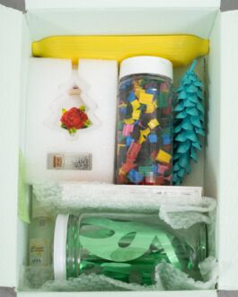 Overhead view of tightly packed objects inside of a brightly painted cardboard box